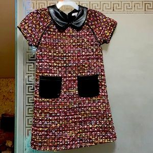 Brand new dress with leather pockets and collar. Size 5.